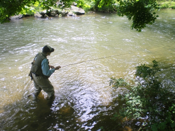 Charles fishing on a local stream