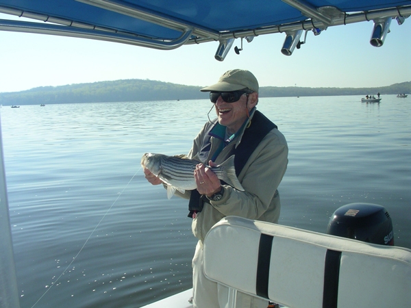 Chalres with a striped bass on the Chesapeake bay