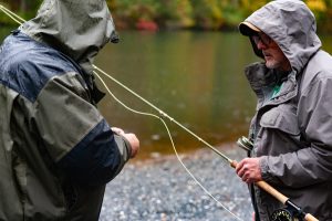 Instructors getting a fly rod ready for casting demonstration