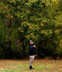 Instructor demonstrating a loop using a fly rod