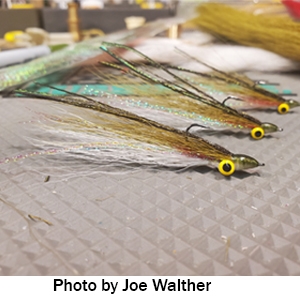 Three clouser minnows tied by Joe Walther