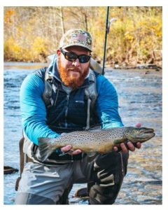 Ben John, Manager of Beaver Creek Fly Shop in Hagerstown, holding a nice steelhead