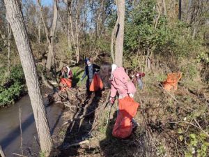 St. James students picking up trash along the creek