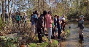 St. James Students and volunteers learning about Beaver Creek