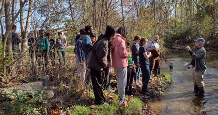 St. James Students and volunteers learning about Beaver Creek