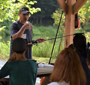 Instructor explains to students the different types of spinning rods