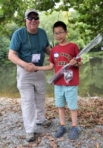 Noel presents Ethan Lee with his new spinning rod