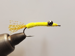 Joe Walther tied this simple shad fly tied using yellow chenille, yellow fluorescent tail and dumbbell eyes